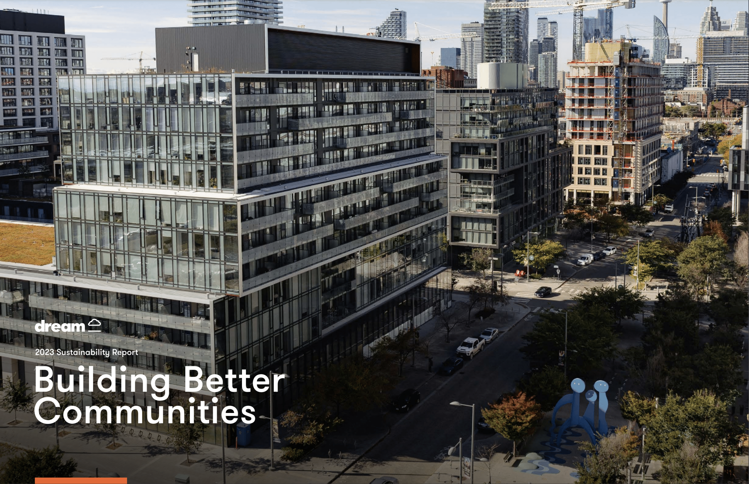 Cityscape with modern glass buildings, high-rises, construction cranes, and tree-lined streets, featuring the text "dream 2023 Sustainability Report Building Better Communities"